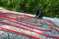 Tyler Affixing Radiant Heat Tubing to 6x6 Wire Mesh